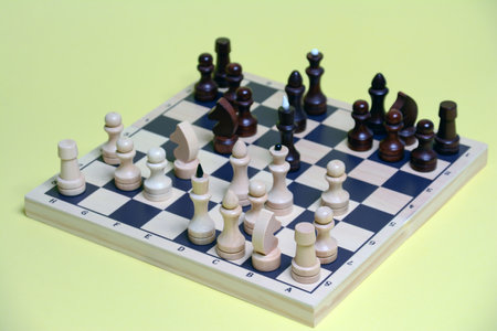 Chess board with chess pieces on a green background. High quality photoの写真素材