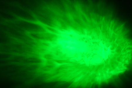 green abstract background with some smooth lines in it and some spots on itの写真素材