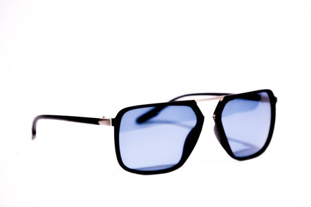 Sunglasses in an iron frame with blue glass isolated on whiteの写真素材
