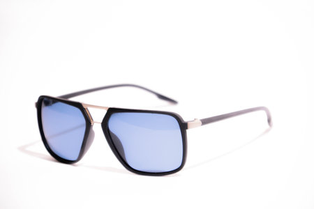 Sunglasses in an iron frame with blue glass isolated on whiteの写真素材