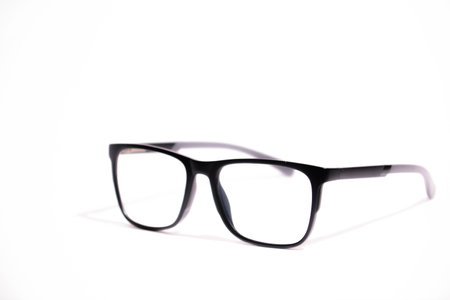Black eye glasses isolated on white background. Selective focus and shallow depth of field.の写真素材