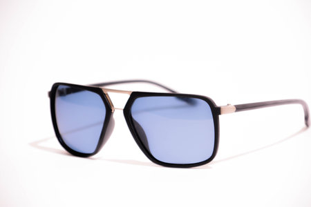 Sunglasses in an iron frame with blue glass isolated on whiteの写真素材