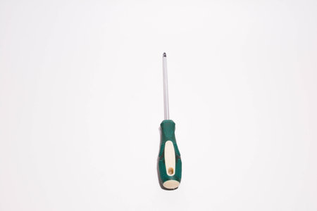 Screwdriver with green handle isolated on white background, work toolの写真素材