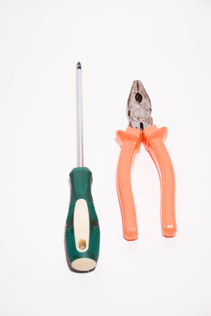 Pliers, screwdriver and pliers on a white background.の写真素材