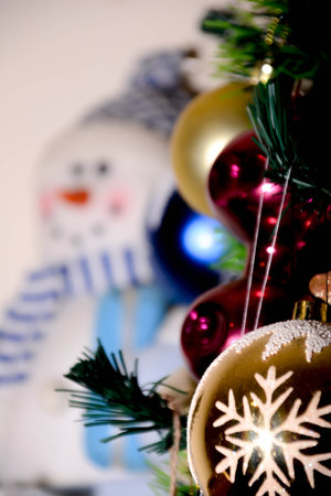 Christmas background with snowman and christmas balls. Selective focus.の写真素材
