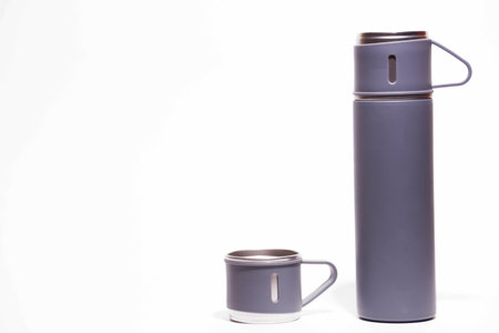 Coffee cup and thermos isolated on a white background.の写真素材