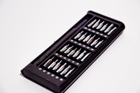 Set of screwdriver bits in a box on a white background.の写真素材