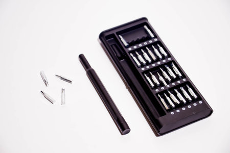 Set of screwdrivers in a black case on a white background.の写真素材