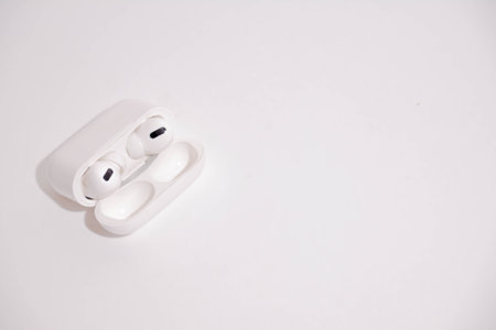 White wireless headphones on a white background. Top view. Copy space.の写真素材