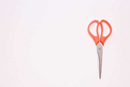 Red scissors isolated on white background with copy space for your text.の写真素材