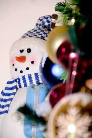 Snowman and christmas decoration on white background. Close up.の写真素材