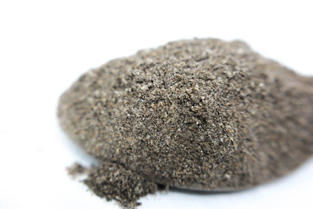Heap of black pepper powder isolated on white background. Top view.の写真素材