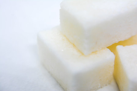 Sugar cubes on a white background. The concept of sugar.の写真素材