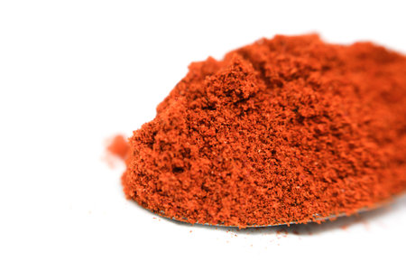 Red paprika powder isolated on white background. Spices and food ingredientsの写真素材