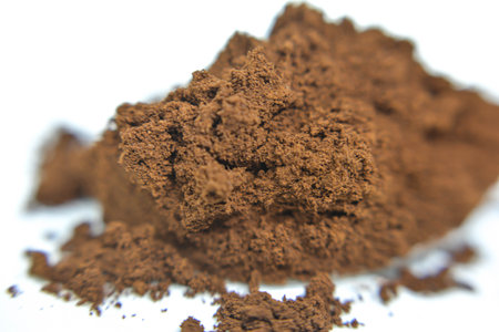 Cocoa powder on a white background. Macro. Selective focus.の写真素材