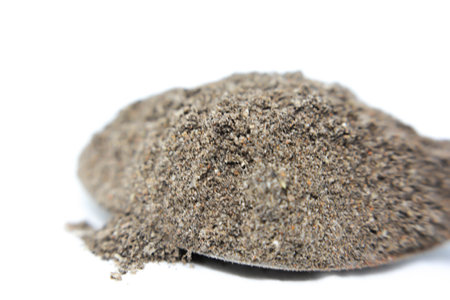 Heap of black pepper on white background. Top view.の写真素材