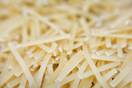 closeup of uncooked italian pasta as background, selective focusの写真素材