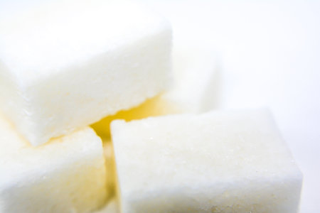 Sugar cubes on white background. Close up. Selective focus.の写真素材