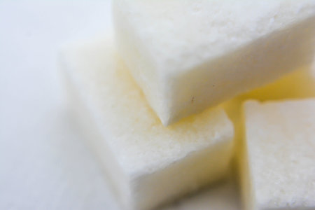 White sugar cubes on a white background. Close-up, macro.の写真素材