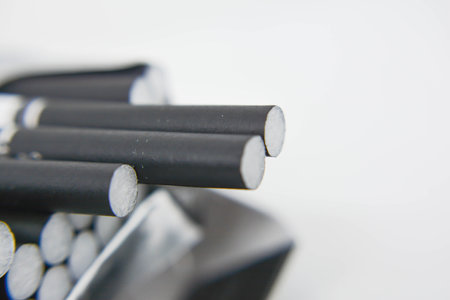 Cigarettes on a white background, close-up, selective focusの写真素材