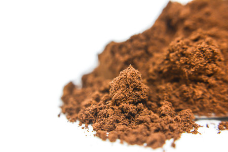 Cocoa powder isolated on white background. Selective focus.の写真素材