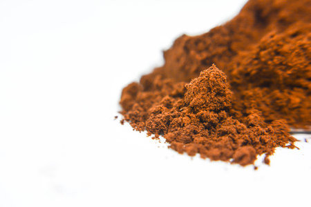 Cocoa powder isolated on white background. Top view. Copy space.の写真素材