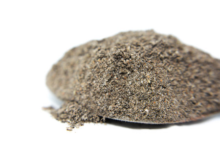 Pile of tea powder isolated on white background. Close up.の写真素材