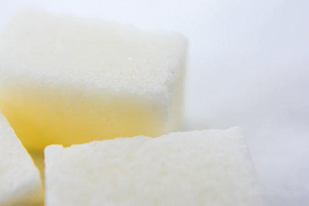 Refined sugar cubes on a white background. Close-up.の写真素材