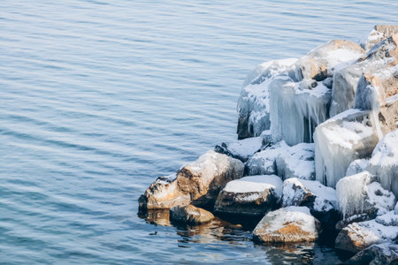 Frozen rocks on the shore of Lake Baikal in winterの写真素材