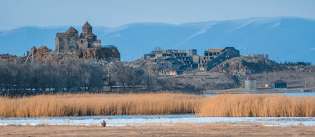 Church on the lake shore. Beautiful monastery on the river bank. Beautiful natural landscape with a temple.の写真素材