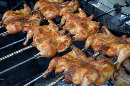 Grilled chicken on the barbecue. Roasted chicken on the grill.の写真素材