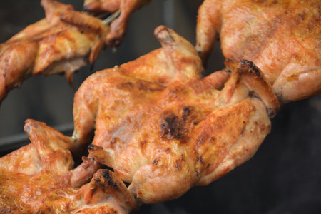 Grilled chicken on the barbecue, close-up, selective focusの写真素材