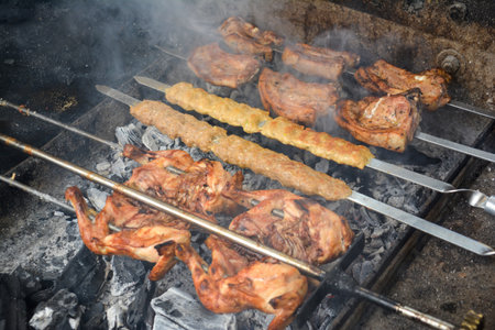 Grilled chicken on skewers on the grill. Close-up.の写真素材