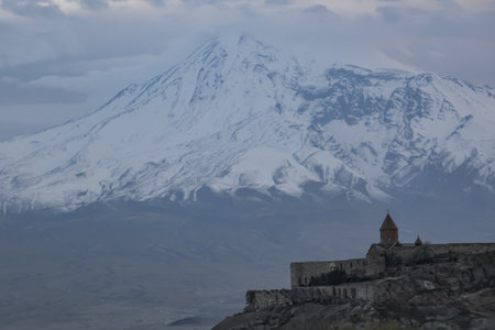 Monastery on the background of the mountain. Beautiful landscape with Mount Ararat and Khor Virap Monastery in Armenia. Beautiful church in the mountains. Armenian church in natureの写真素材