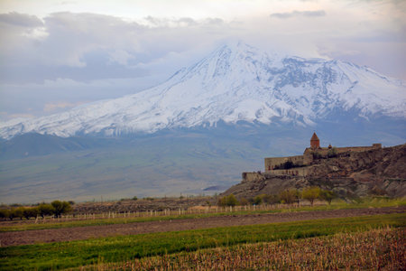 Monastery on the background of the mountain. Beautiful landscape with Mount Ararat and Khor Virap Monastery in Armenia. Beautiful church in the mountains. Armenian church in natureの写真素材