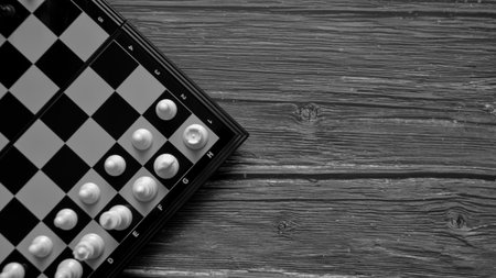 Black and white chess on a black and white wooden background. Black and white photo.の写真素材