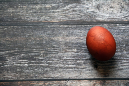 Easter egg on wooden background. Top view with copy space.の写真素材