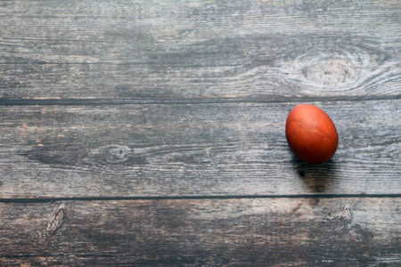 Easter egg on wooden background. Top view. Copy space.の写真素材
