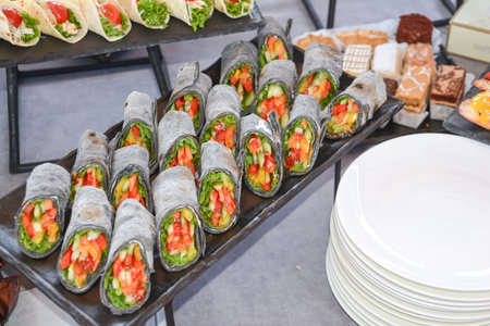 catering buffet food indoor in luxury restaurant with meat colorful fruits and vegetablesの写真素材