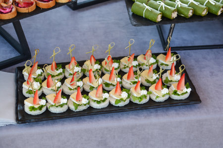 catering food on the table, canape with meat and vegetablesの写真素材