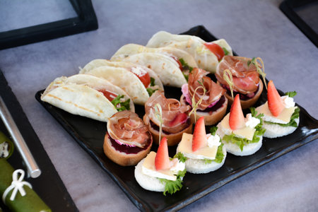 Catering buffet with variety of food snacks and appetizers.の写真素材