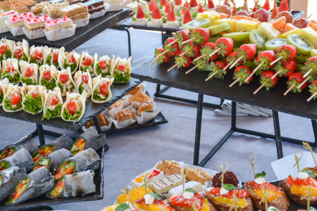 Catering buffet with different food snacks and appetizers on the tableの写真素材