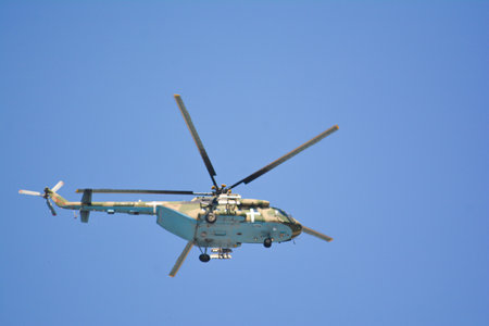 helicopter flying in the blue sky, closeup of photoの写真素材