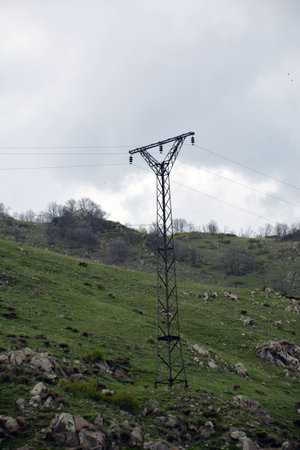 High voltage power line on a hillside in the mountains of Armeniaの写真素材