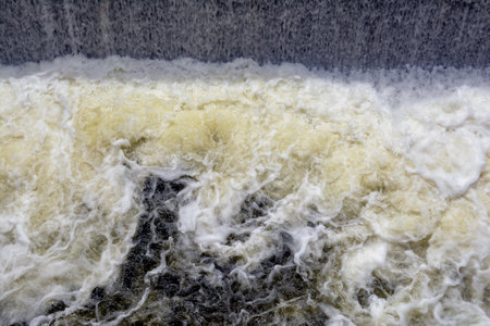 Close up of water flowing from a dam in the Mekong Delta, Vietnam