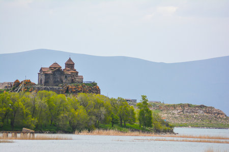 Church on the seashore. Monastery in nature. Armenian church on the river bank. Beautiful...