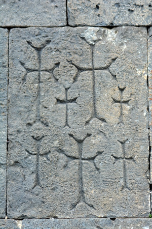 Cross on a stone. Armenian Khachkars. Sculpture of a cross on flat stonesの写真素材