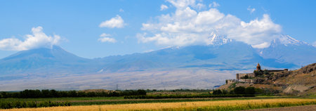Church and beautiful natural landscape. Monastery in nature. Armenian Church in mount. Beautiful architecture of the church. Monastery against the backdrop of rocky mountains.の写真素材