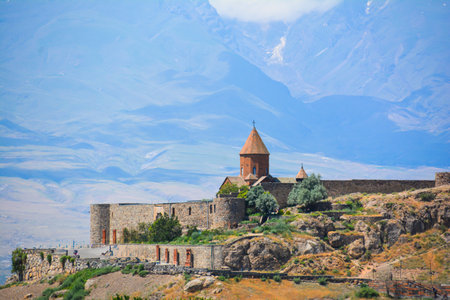 Church and beautiful natural landscape. Monastery in nature. Armenian Church in mount. Beautiful architecture of the church. Monastery against the backdrop of rocky mountains.の写真素材