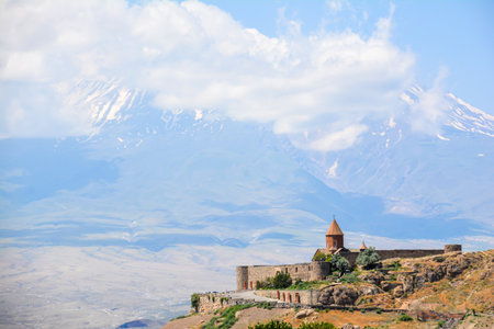 Church and beautiful natural landscape. Monastery in nature. Armenian Church in mount. Beautiful architecture of the church. Monastery against the backdrop of rocky mountains.の写真素材